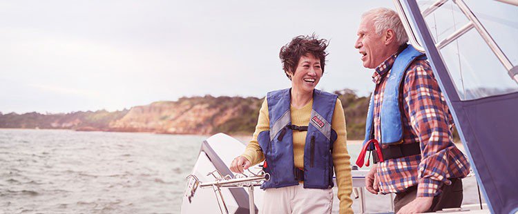 Couple laughing on boat