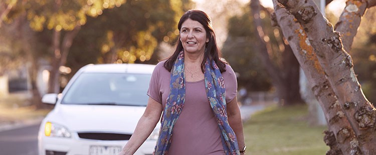 woman locking white car