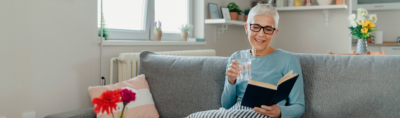 Senior Woman Reading Book at Home