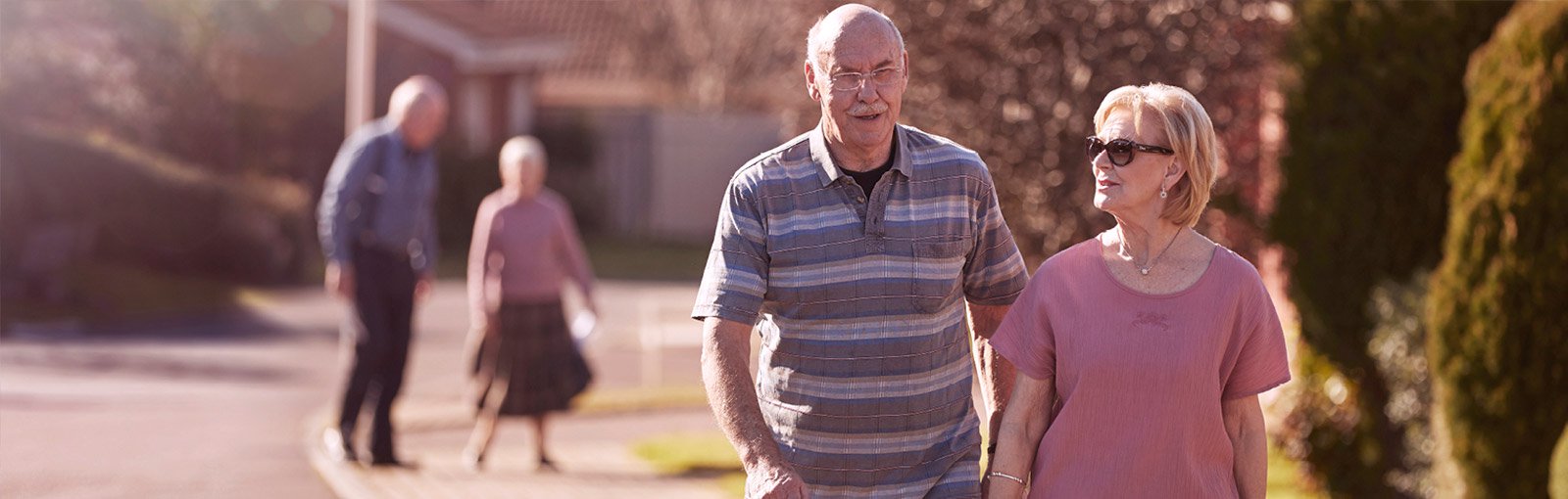 Two old couple walking in the village