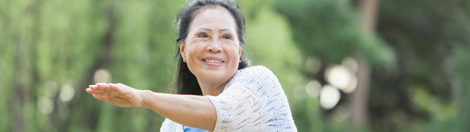 woman in park doing taichi