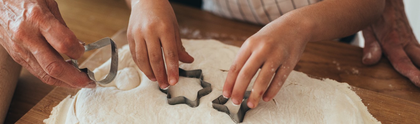 Children baking start shaped sweets.