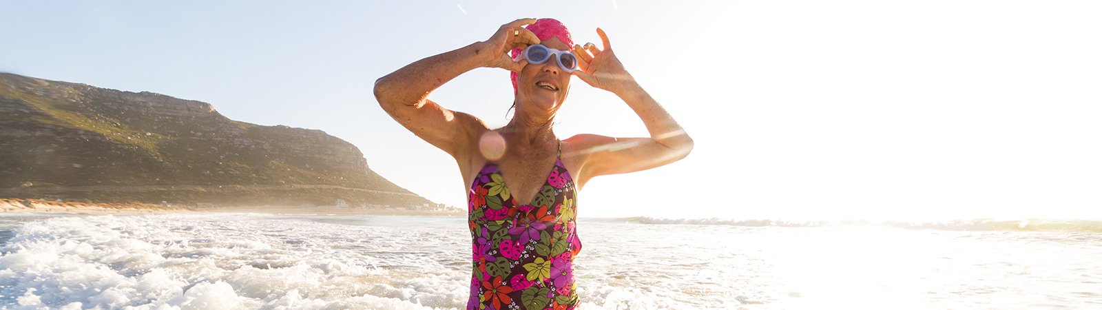 Old lady in swimsuit at the beach