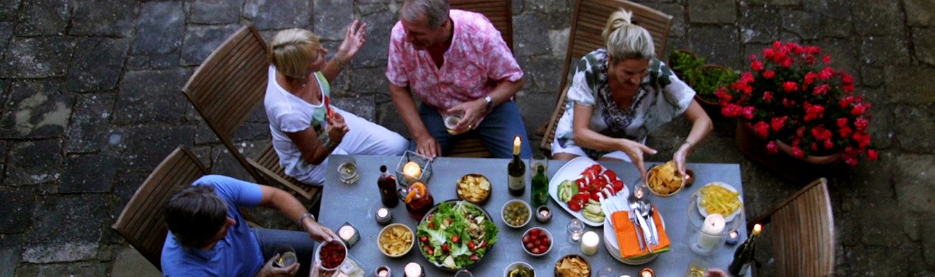 Group of people having dinner outside