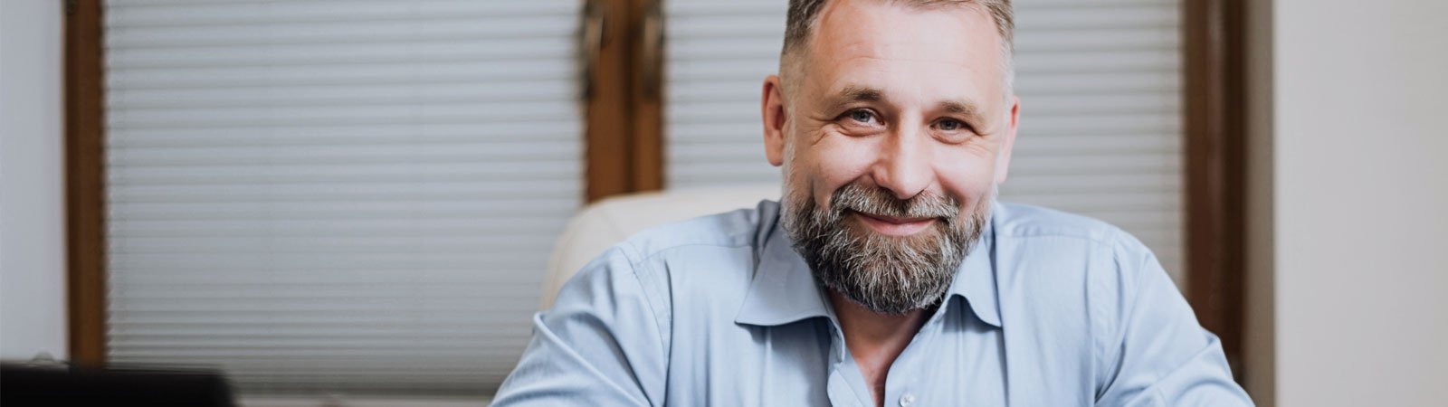 Man smiling in office