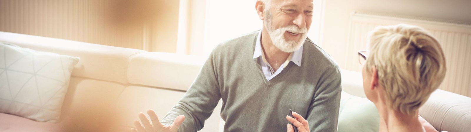 Man smiling & giving advice to woman