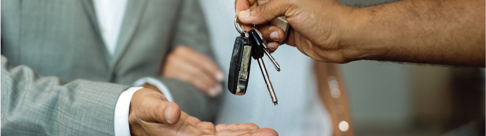 Mechanic handing keys to customer