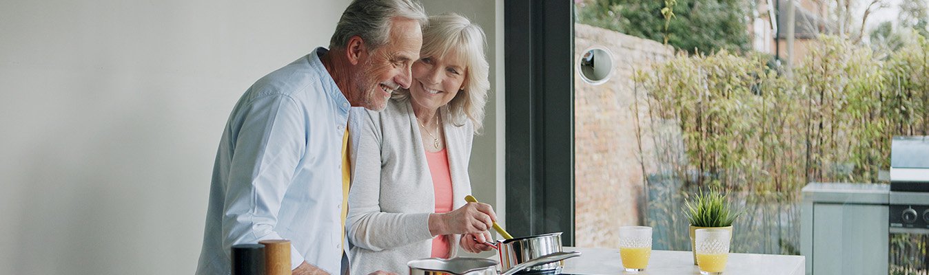 Senior couple cooking a healthy meal together