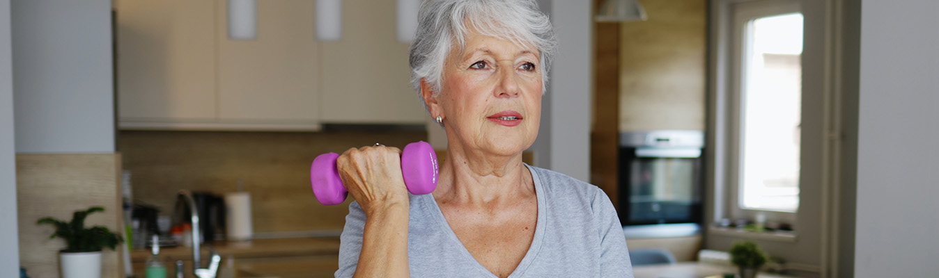 Woman exercising with dumbbells